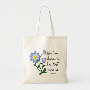 Simple blue flowers ". . . He First Loved Us" Tote Bag