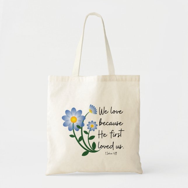 Simple blue flowers ". . . He First Loved Us" Tote Bag (Front)