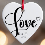 Simple Elegant Minimalist Personalised Christmas Ceramic Ornament<br><div class="desc">Introducing our Simple Elegant Minimalist Personalised Christmas Ceramic Ornament. This black and white design embodies the essence of a clean and simple, minimalist Christmas. It's the perfect choice for celebrating various occasions, from a first Christmas engaged to a thoughtful anniversary present for a husband and wife. Customised with your names...</div>