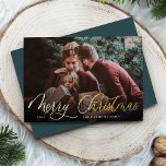 Simple Gold Script Overlay Merry Christmas Photo Foil Holiday Card<br><div class="desc">Elegant Christmas photo card features a single horizontal or landscape-orientated photo with "Merry Christmas" overlaid in gold foil calligraphy script lettering. Personalise with your family name or individual names and the year beneath in modern white lettering. A simple and chic choice for your holiday greetings.</div>