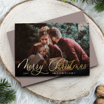 Simple Gold Script Overlay Merry Christmas Photo Foil Holiday Card<br><div class="desc">Elegant Christmas photo card features a single horizontal or landscape-orientated photo with "Merry Christmas" overlaid in gold foil calligraphy script lettering. Personalise with your family name or individual names and the year beneath in modern white lettering. A simple and chic choice for your holiday greetings.</div>