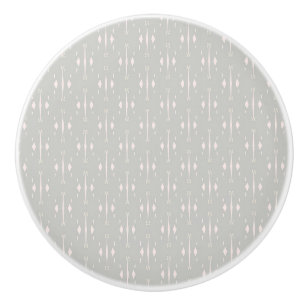 Simple light grey pattern on a grey background. ceramic knob