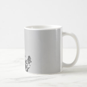 Simple, modern photo of seagull on top of statue coffee mug
