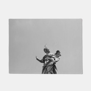 Simple, modern photo of seagull on top of statue doormat