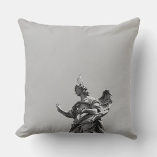 Simple, modern photo of seagull on top of statue outdoor cushion