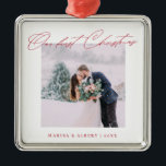 Simple Modern Script Our First Christmas Wedding Metal Ornament<br><div class="desc">A beautiful keepsake to celebrate your first Christmas as a married couple. This design features your favourite wedding photo in a simple white frame with the headline "Our first Christmas" in red modern script font. Personalise with your names and years in red. Makes a great gift.</div>