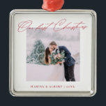 Simple Modern Script Our First Christmas Wedding Metal Ornament<br><div class="desc">A beautiful keepsake to celebrate your first Christmas as a married couple. This design features your favourite wedding photo in a simple white frame with the headline "Our first Christmas" in red modern script font. Personalise with your names and years in red. Makes a great gift.</div>