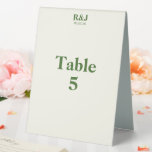 Simple Modern Wedding Monogram Table Number Card<br><div class="desc">Create table number cards featuring your desired monograms and special date. Very light shade of yellow with green font. Simple, modern appeal. Perfect with the wedding supplies from the Romantic Tree Design collection. Add your couple monogram, date of the wedding, and table number. Use the template to create your own...</div>