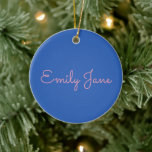 Simple Typography in Pink and Blue Personalised Ceramic Ornament<br><div class="desc">Add a personal touch to your holiday decorations with this elegant ceramic ornament featuring a customisable name design in soft, modern script against a bold blue background. Perfect for creating lasting memories, this ornament makes a meaningful keepsake for family, friends, or even yourself. Hang it on your tree, gift it...</div>