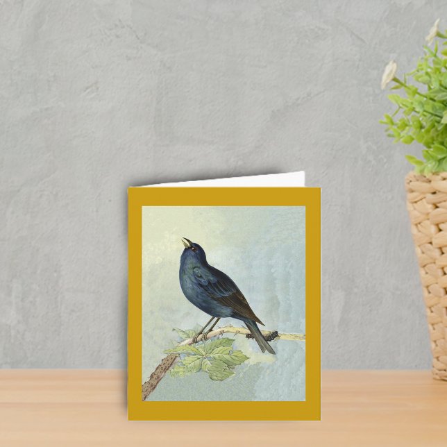 Singing Blackbird Watercolor Note Card (Elegant singing blackbird on branch with caterpillar leaves on dark golden yellow boder notcard.)