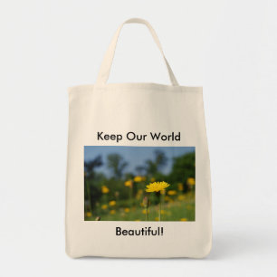 Single dandelion against the field tote bag