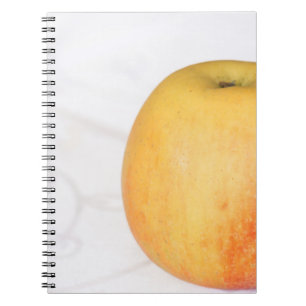 Single ripe apple notebook
