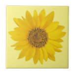 Single Yellow Sunflower on Light Yellow Ceramic Tile<br><div class="desc">A close-up photo of a bright yellow sunflower.</div>