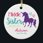 Sisters Colourful Unicorn Middle Sister Christmas Ceramic Ornament<br><div class="desc">Sisters Colourful Unicorn Middle Sister Personalised Christmas Ornament. Personalise this adorable ornament with name underneath a beautiful purple unicorn silhouette. Text reads MIDDLE SISTER with pretty hearts and underlined in curling lines.Text in hot pink, turquoise with blue and pink hearts and yellow accents. Back of ornament with pretty turquoise background...</div>
