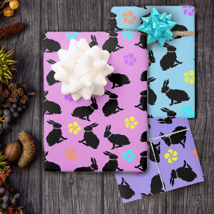 Sitting Black Bunnies Wearing Flowers on Pastels Wrapping Paper Sheet