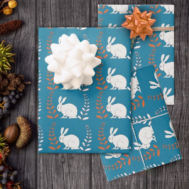 sitting elegant White Rabbit Flowers Dark Blue Wrapping Paper Sheet (Rows of white rabbits with orange and white flower plants on roll of dark blue wrapping paper.)