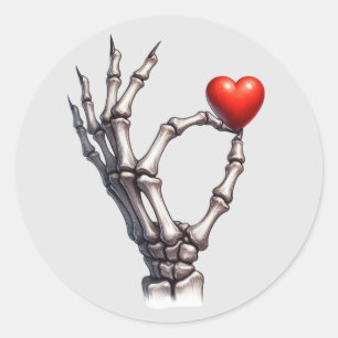 Skeleton Hand Balancing Small Heart Classic Round Sticker