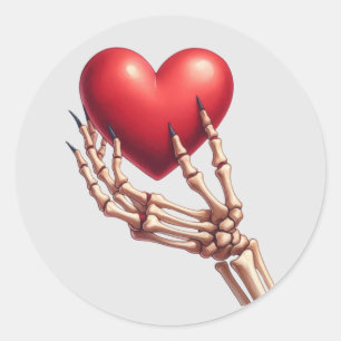 Skeleton Hand Raising Red Heart Classic Round Sticker