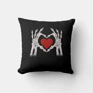 Skeleton Hands Form A Heart With Red Heart Cushion
