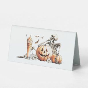 Skeleton with pumpkin and drink. Halloween.