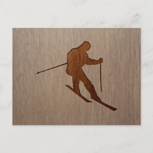 Skiing silhouette engraved on wood design postcard