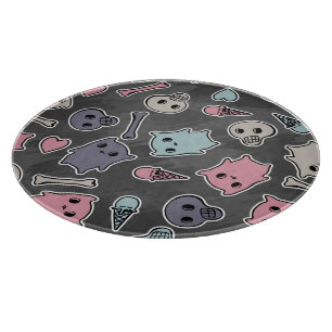 Skulls, and hearts on black background cutting board