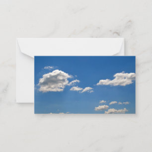 Sky is blue and white clouds are passing by   card