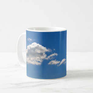 Sky is blue and white clouds are passing by coffee mug