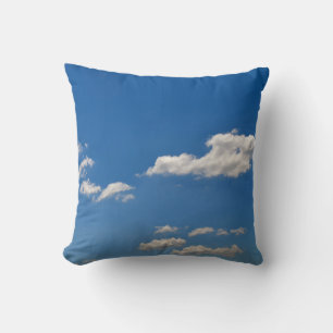 Sky is blue and white clouds are passing by cushion