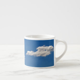 Sky is blue and white clouds are passing by  espresso cup