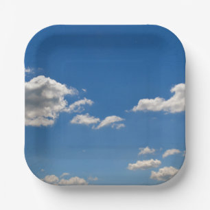 Sky is blue and white clouds are passing by paper plate