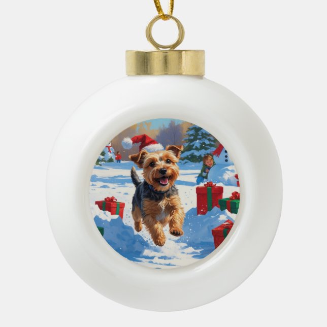 Skye Terrier Running in Snow with Christmas Hat Ceramic Ball Christmas Ornament (Front)