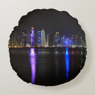 Skyline of Doha, Qatar at night round pillow