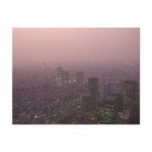 Skyscrapers bathed in a pale pink glow.