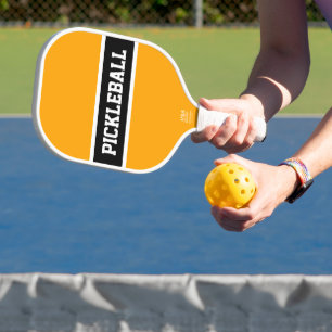 Sleek Black White Racing Stripes On Golden Orange Pickleball Paddle
