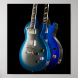 Sleek Blue Electric Guitars Poster<br><div class="desc">Love the look of these two blue guitars together,  very sleek looking especially with the black background.</div>