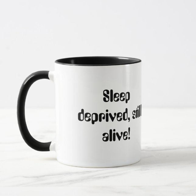 Sleep deprived,still alive! mug (Left)