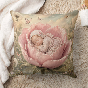 Sleeping baby in pink flower cushion