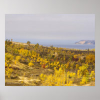 "SLEEPING BEAR DUNES AGLOW WITH GOLDEN VEGETATION"