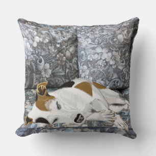 Sleeping Jack Russell on a Blue Floral Sofa Cushion