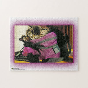 Sleeping Kitten In A Burgundy Purse Jigsaw Puzzle