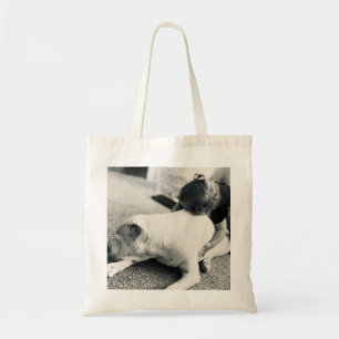 Sleepy puppy pitbull and baby cuddles tote bag