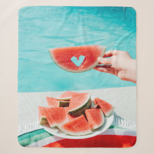 Sliced watermelon on white paper sherpa blanket