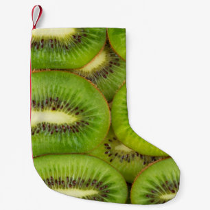 Slices of fresh and ripe kiwi fruit in rowsbrown,c small christmas stocking