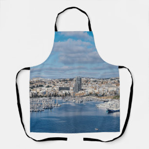 Sliema harbor with modern buildings and boats apron
