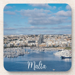 Sliema harbour with modern buildings and boats coaster