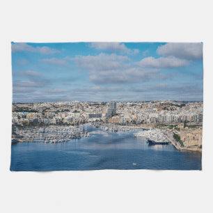 Sliema harbour with modern buildings and boats tea towel