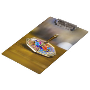 SlipperyJoe Hanukkah dreidel gift octagonal base b Clipboard