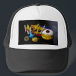 SlipperyJoe Hanukkah symbolic still life holiday e Trucker Hat<br><div class="desc">SlipperyJoe Hanukkah symbolic still life holiday essence vibrant meaningful objects colourful slender pile menorah candles artistic red blue yellow and white sufganiyah doughnut classic jelly-filled commemorate miracle of the oil dreidels metallic gold glossy blue Hebrew great miracle happened there metallic pewter star of David medallion light resilience community themes spiritual...</div>