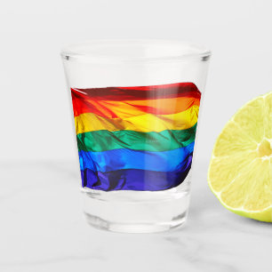 SlipperyJoe's gay pride flag waving pride colours Shot Glass
